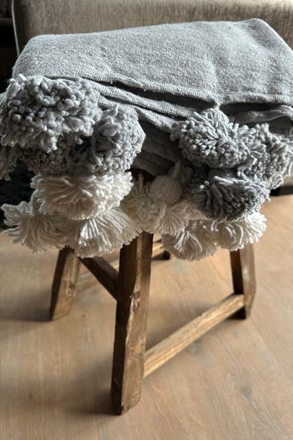 Marokkaanse pompom deken